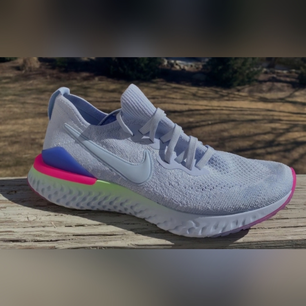 Nike Women’s White Flyknit Running Shoe with Neon Accent